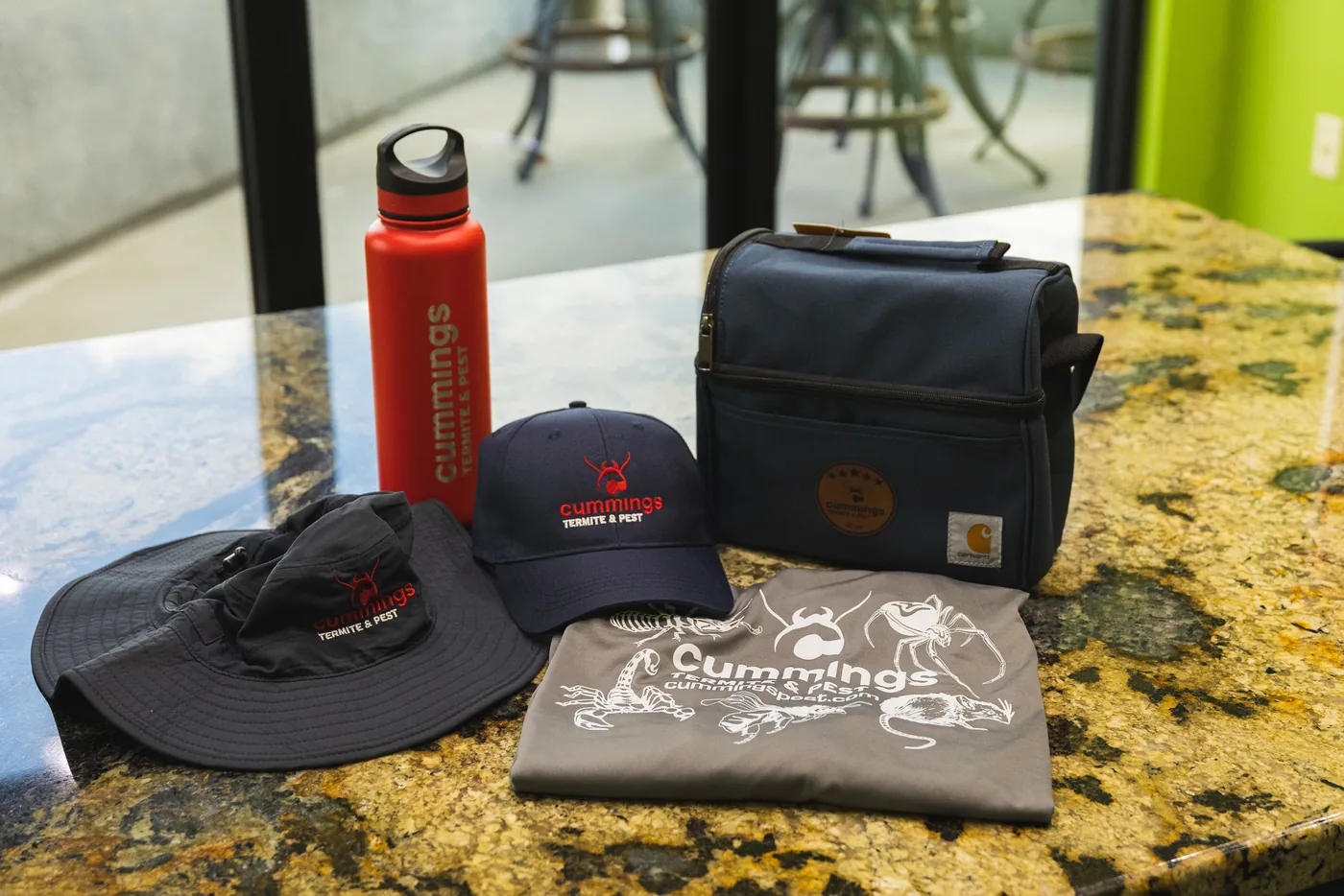Cummings branded hats, shirt, water bottle, and work bag