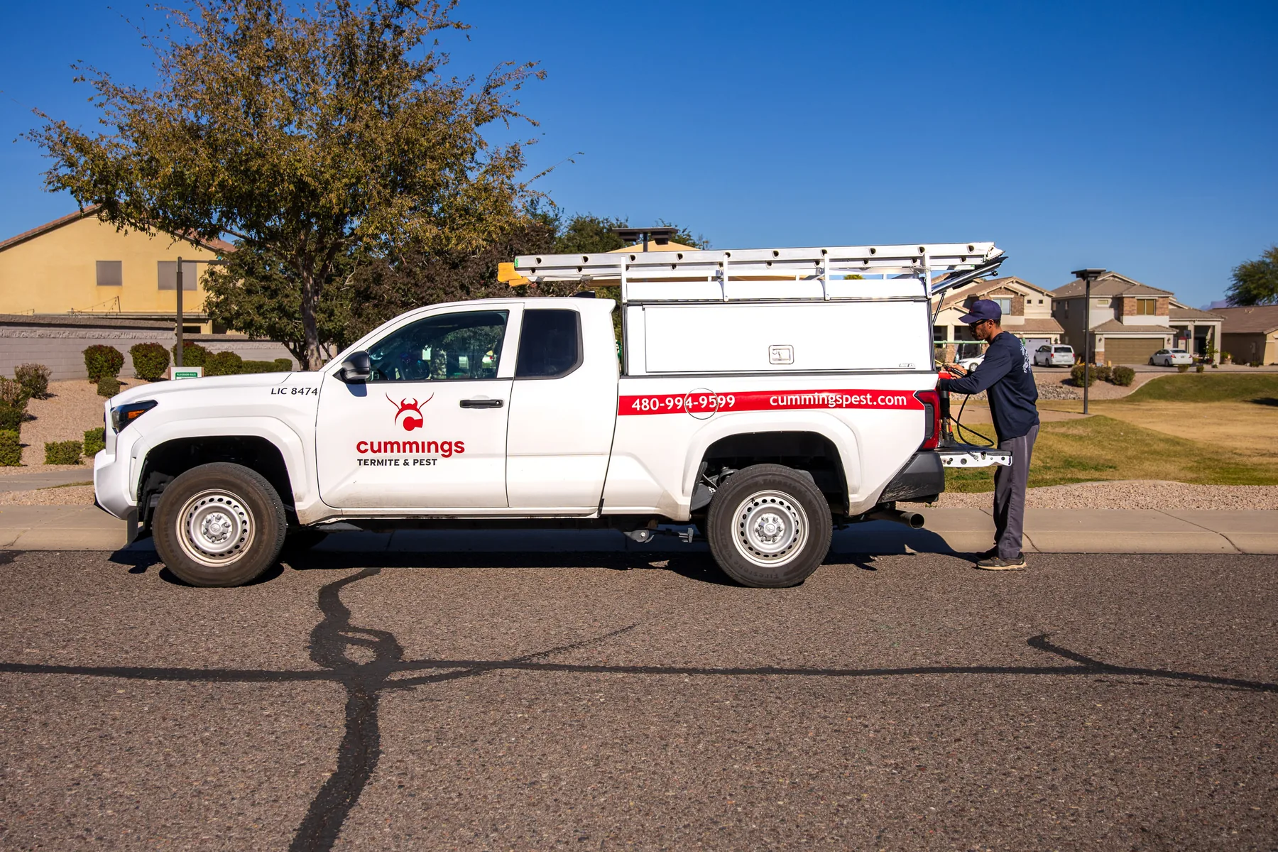 Cummings technician preparing equipment beside a branded service truck