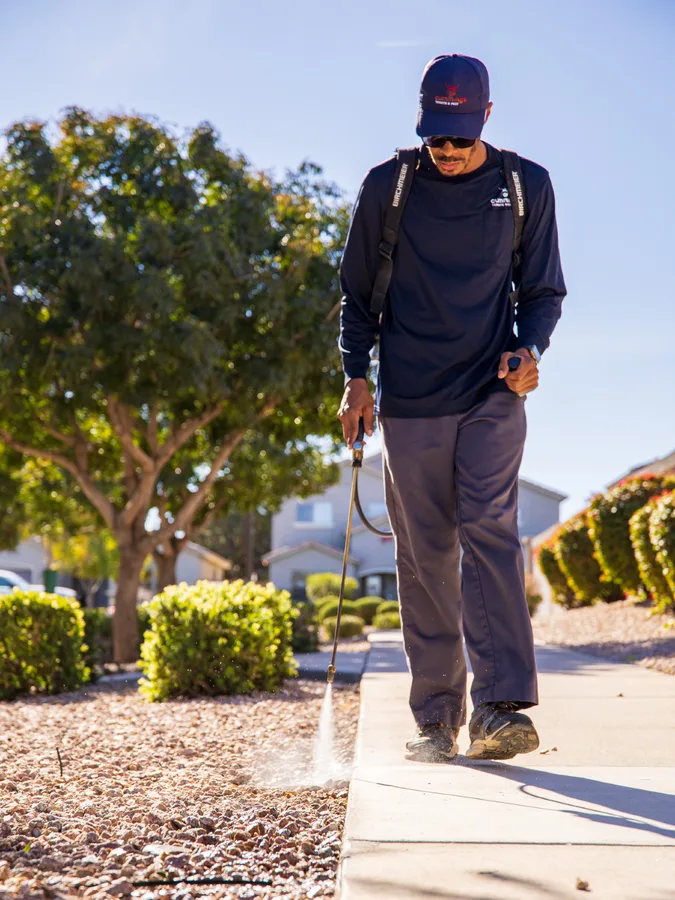 Cummings technician treating the perimeter of an Arizona property